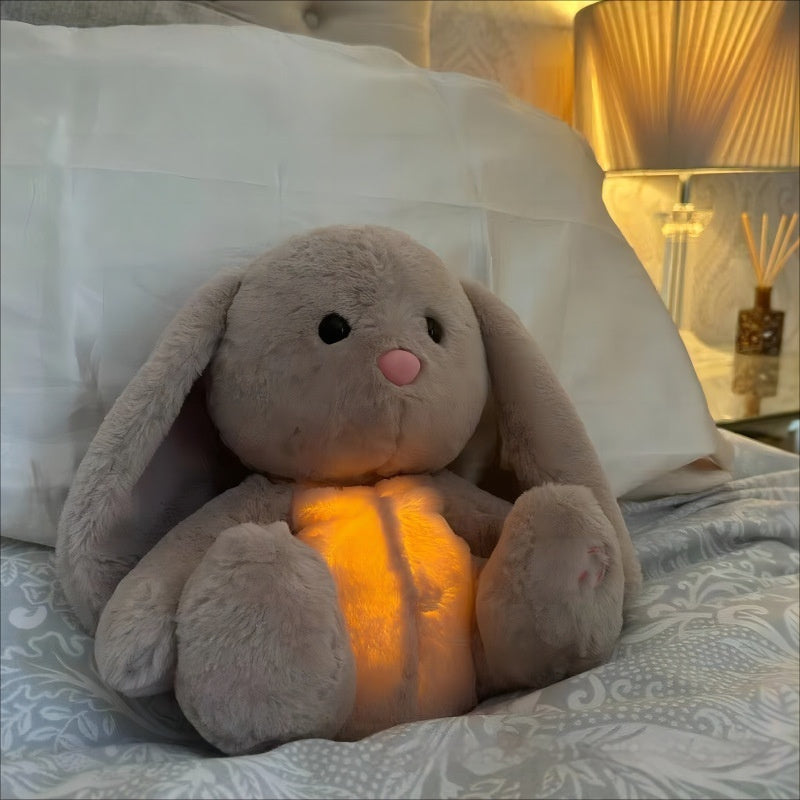Conejo con efecto calmante como sonidos respiratorios e iluminación para niños y adultos.