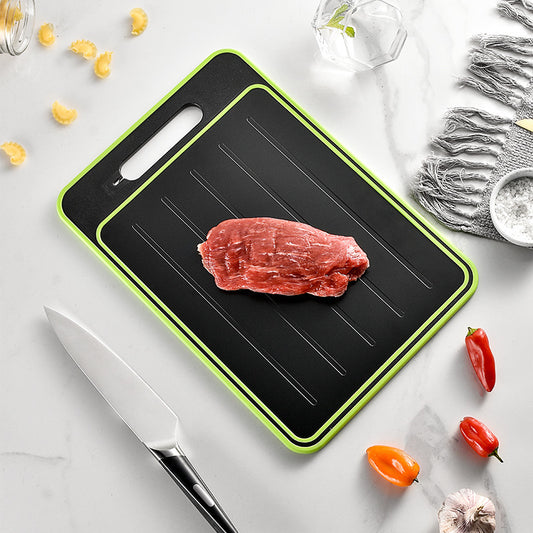 Double-sided cutting board with defrost function, knife sharpener and grater.